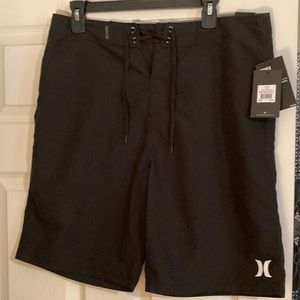New! Hurley black board shorts size 33. 21 inch length. Tie front, back pocket.